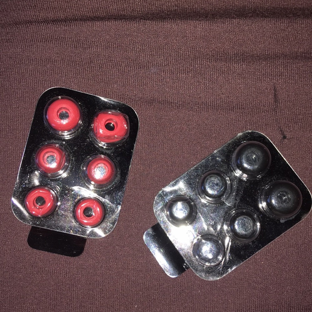 6 pink caps and 5 black caps missing 1 small black